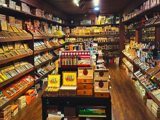 Churchill's Fine Cigars walk-in humidor stocked with Davidoff, Arturo Fuente, and Padrón cigars